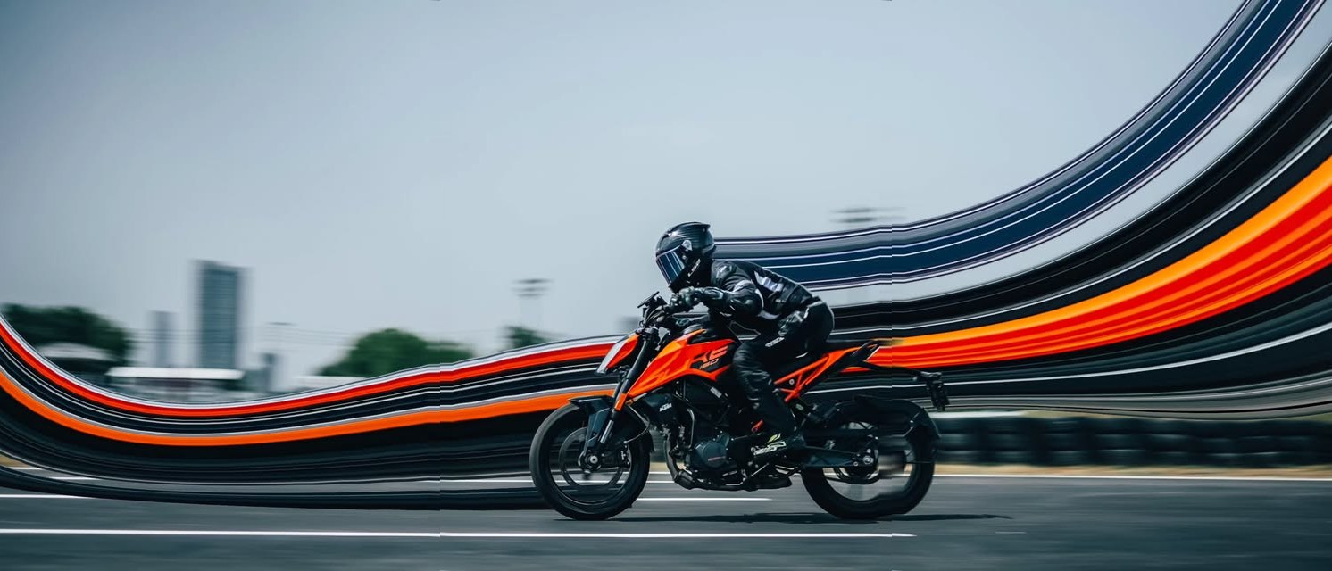 Rider on an orange naked bike, background dissolving into arcs of light